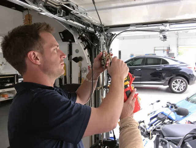 Darien Garage Door Repair safety certified technician performing cable replacement in Darien