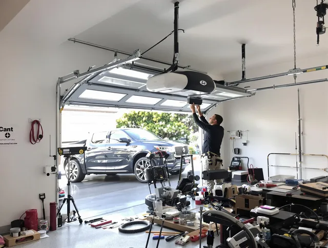 Darien Garage Door Repair specialist installing smart garage door opener system in Darien home