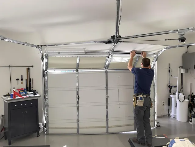 Darien Garage Door Repair specialist performing precise section replacement on Darien garage door