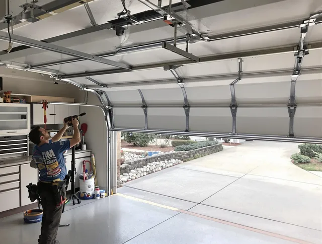 Garage door track repair service by Darien Garage Door Repair in Darien